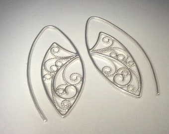 Filigree sterling silver blade earrings in the style of an alien insect wing or maybe a tiny fairy creature