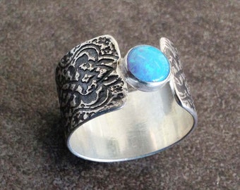 Blue opal sterling silver ring with arabesque pattern texture wide band