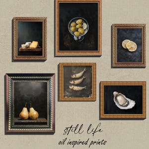 May include: Six framed oil paintings of still life subjects, including olives, cheese, pears, fish, lemons, and an oyster. The paintings are displayed on a beige wall with the text "still life oil inspired prints" below.