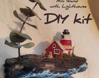 May include: A miniature DIY kit featuring a lighthouse and a small red house on a wooden base, with a faux tree. The base is painted to resemble an island with blue and white waves. The text "Mini Island with Lighthouse DIY kit" is visible.