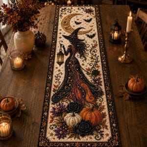 May include: A rectangular table runner featuring a beaded and embroidered design of a witch in a pointed hat holding a lantern, set against a crescent moon and bats. The base is cream with orange, purple, and black floral and pumpkin accents.