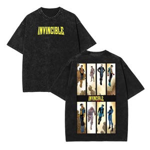 May include: Black t-shirt with the word "INVINCIBLE" printed in yellow on the front. The back of the shirt features a comic book style graphic of characters from the Invincible series.