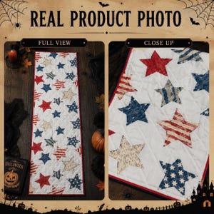 May include: A rectangular quilted table runner featuring a white background with a repeating pattern of stars in red, blue, and beige. The stars display various textures including stripes and polka dots. The runner has a thin red border trim.