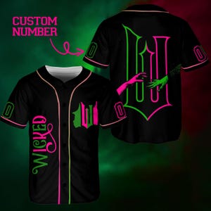 May include: Black baseball jersey with pink and green accents. The jersey features the word "WICKED" in a script font, a stylized "W", and the text "CUSTOM NUMBER". The back of the jersey displays a large "W" design with reaching hands.
