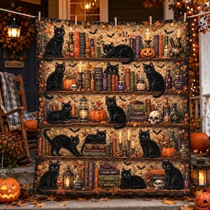 May include: A quilted wall hanging featuring a multi-shelf bookcase design filled with black cats, stacks of books, pumpkins, skulls, lanterns, and candles. The scene is decorated with autumn leaves and bats, creating a detailed Halloween-themed display.