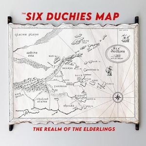 May include: A black and white map of the Six Duchies, a fictional realm. The map is titled "The Six Duchies Map" and "The Realm of the Elderlings". The map features various geographical features, including mountains, rivers, seas, and islands.
