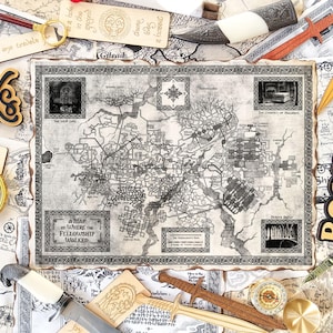 May include: An assortment of fantasy-themed items, including a detailed map, decorative swords, a compass, and a magnifying glass. The word "Books" is featured in a wooden cutout. The map reads "A Map of Where the Fellowship Walked."