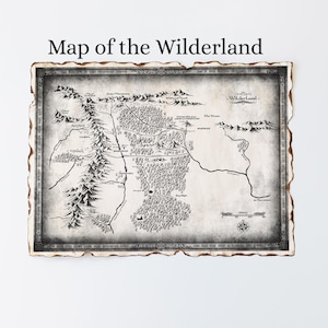 May include: A detailed map of the Wilderland, featuring mountains, forests, and rivers, with the title "Map of the Wilderland" at the top. The map has a vintage, aged appearance with a decorative border and a compass rose at the bottom.