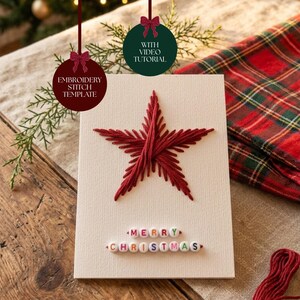 May include: A cream-coloured greeting card featuring a red star created with embroidery thread. Below the star, the words MERRY CHRISTMAS are spelled out using white plastic beads with colourful letters. Two circular tags are attached, reading EMBROIDERY STITCH TEMPLATE and WITH VIDEO TUTORIAL.