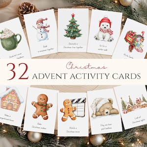 May include: A collection of 32 Christmas advent activity cards. Each card displays a watercolour illustration and a festive activity prompt, like "Decorate a Christmas tree together" or "Write Santa". The cards are arranged on a wooden surface.