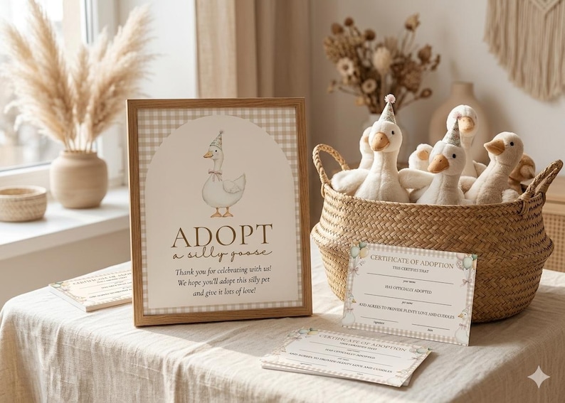 May include: A framed sign with a watercolor illustration of a goose wearing a party hat, with the text "ADOPT a silly goose." A woven basket holds several plush geese, also wearing party hats. Certificates of adoption are also visible.