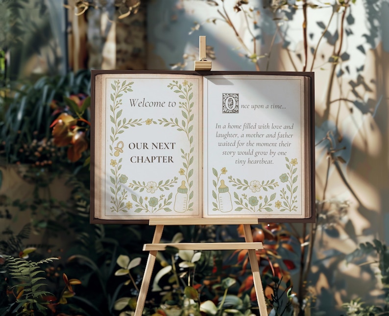 Puede incluir: Un libro abierto sobre un caballete de madera. La p&aacute;gina izquierda dice "Welcome to Our Next Chapter", la p&aacute;gina derecha tiene un poema que comienza "Once upon a time...". Ilustraciones florales y de biberones decoran las p&aacute;ginas.