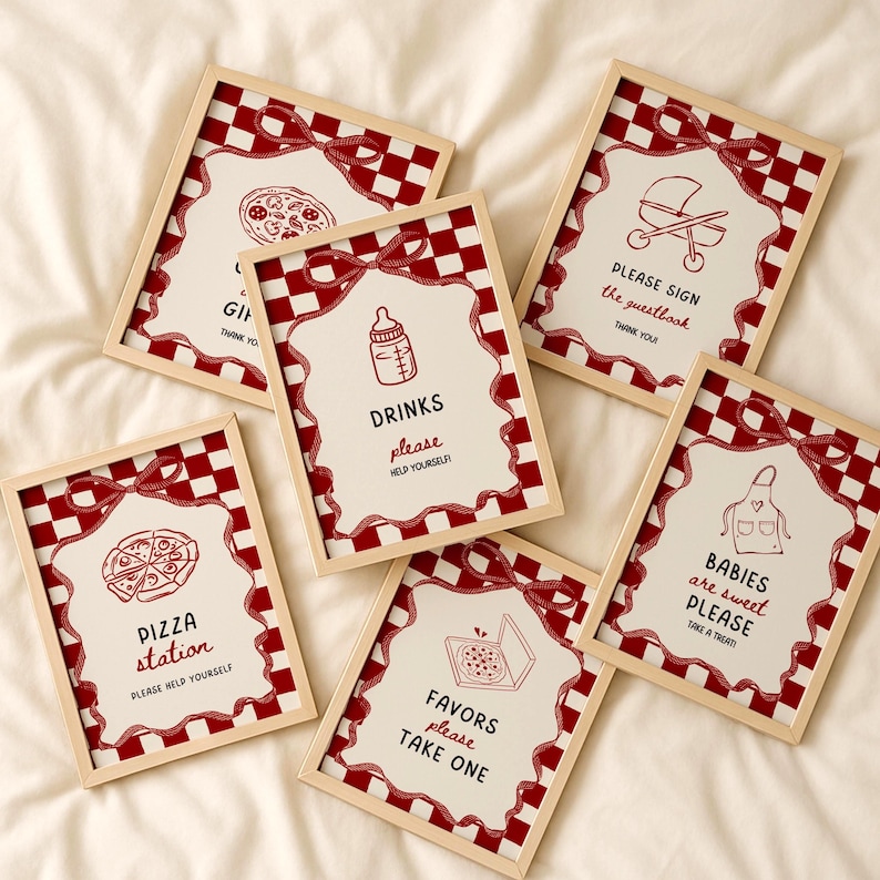 May include: Six framed signs with a red and white chequered border and a red ribbon design. Each sign features a different illustration and text, including a pizza, baby bottle, and a pram. The signs are for a party or event.