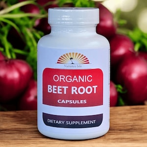 May include: A white bottle of "Natures Isle" organic beet root capsules. The label is red with white text. The background features fresh beets and green foliage, suggesting a natural product.