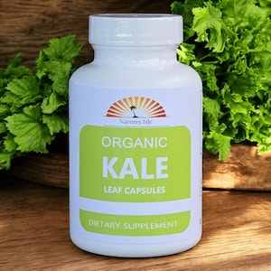 May include: A white bottle of "Natures Isle" organic kale leaf capsules. The label features a green rectangle with the word "KALE" in large letters. The bottle is a dietary supplement.