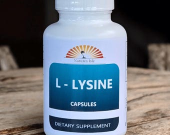 May include: A white plastic bottle of L-Lysine capsules. The label features the text "L-LYSINE CAPSULES" in white letters on a blue background, with "Natures Isle" logo above. The bottle is a dietary supplement.
