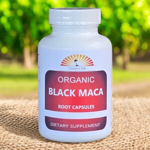 May include: A white bottle with a white cap, featuring a label with the text "ORGANIC BLACK MACA ROOT CAPSULES" in a maroon rectangle. The label also includes the text "Natures Isle" and "DIETARY SUPPLEMENT".