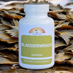 May include: A white bottle of "Bladderwrack Capsules" dietary supplement. The label features a green rectangle with the product name and the "Natures Isle" logo. The background shows dried seaweed.