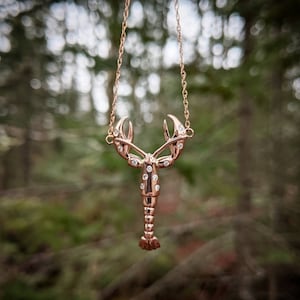 14 karat rose gold lobster necklace! Has .13 carts of round diamonds! 18" rose gold chain.