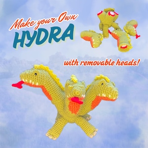 May include: A green crocheted hydra with three removable heads. The hydra has a yellow crest and orange mouths. The text "Make your own HYDRA with removable heads!" is written on the image.