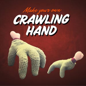 May include: Two crocheted crawling hands in green with pink bone accents and purple trim. The text "Make your own CRAWLING HAND" is displayed in white and orange on a red background.