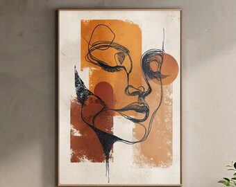 Può includere: Stampa artistica astratta con un disegno a tratto minimalista di un volto. L'opera d'arte è ambientata su uno sfondo di forme geometriche arancioni e marroni. La stampa incorniciata ha una palette di colori neutri, adatta a vari stili di interni.