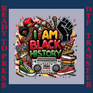 May include: A colorful graphic design with the text "I AM BLACK HISTORY" surrounded by illustrations of a boombox, sneakers, a raised fist, and other cultural symbols. The design is set against a light gray background with the words "READY TO PRESS" and "DTF TRANSFER" in red.
