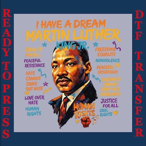 May include: A DTF (Direct to Film) transfer design featuring a portrait of Martin Luther King Jr. with the text "I Have a Dream." Additional text includes "Human Rights," "Equality," and "Justice for All." The design is in shades of blue, orange, and red.