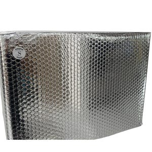 May include: Silver bubble wrap mailer with a reflective surface. The mailer has a small, circular sticker with the letter "S" and the text "SONGAPSUS" and "BORNEO". The bubble wrap texture is visible across the surface.