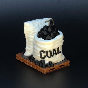 May include: A white ceramic mug with a black handle and the text "But First, Coffee" in a handwritten style. The mug is on a white surface. The mug is approximately 4 inches tall.