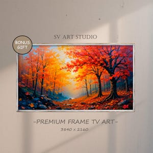 May include: A painting of a forest scene with vibrant fall foliage in shades of red, orange, and yellow. The trees are tall and slender, with their branches reaching up towards the sky. The sun is shining through the trees, casting a warm glow on the forest floor. The painting is framed in a white frame.