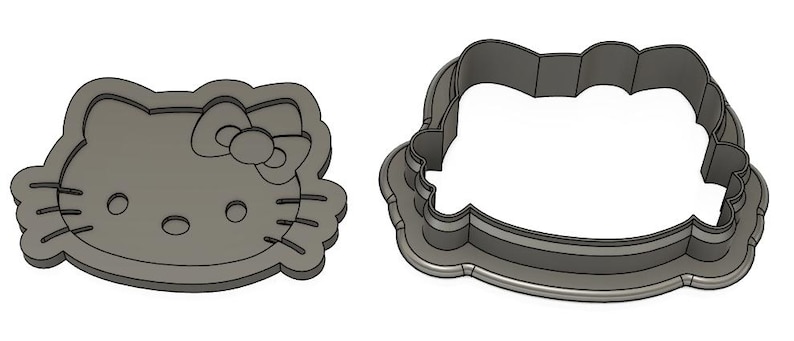 May include: Two metal cookie cutters, one shaped like Hello Kitty's face and the other a simple oval.