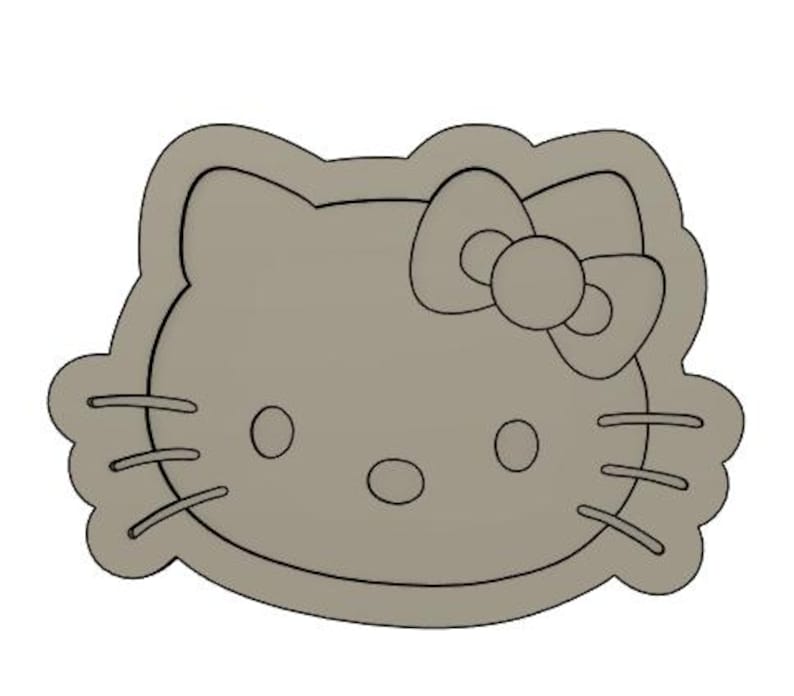 May include: A gray cookie cutter shaped like a cartoon cat with a bow. The cat has large eyes, a small nose, and a wide mouth.