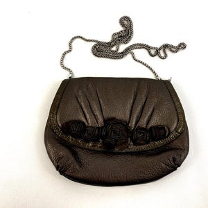 Brighton Velvet Rose Pouch Purse Done In A Metallic Brown Color With A Detachable Shoulder Strap image 1