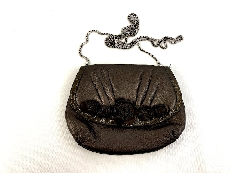 Brighton Velvet Rose Pouch Purse Done In A Metallic Brown Color With A Detachable Shoulder Strap image 1