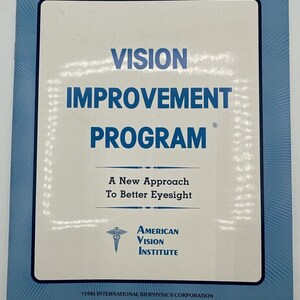 May include: A blue and white book cover with the title "VISION IMPROVEMENT PROGRAM" and the text "A New Approach To Better Eyesight" and the logo "AMERICAN VISION INSTITUTE" with a caduceus symbol. The copyright is "©1981 INTERNATIONAL BIOPHYSICS CORPORATION".