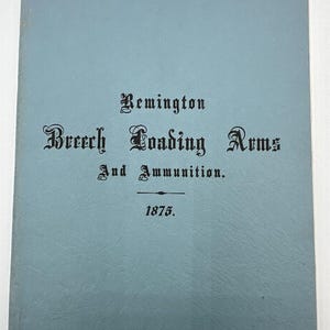 May include: A blue book with the title "Remington Breech Loading Arms And Ammunition. 1875."