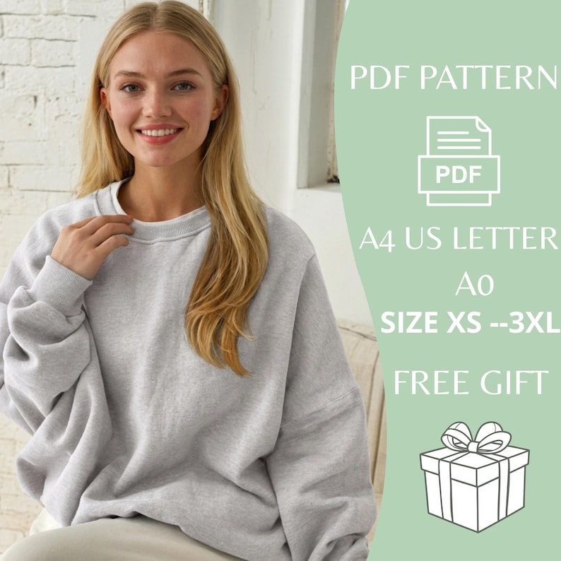 May include: A light gray sweatshirt with a crew neck. The image includes text that reads "PDF PATTERN", "A4 US LETTER", "Ao", "SIZE XS --3XL", and "FREE GIFT". A woman with blonde hair is wearing the sweatshirt.