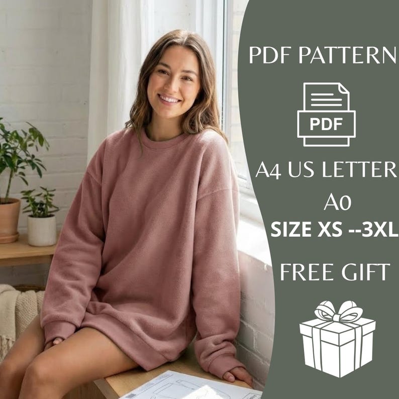 May include: A woman wearing a dusty rose-colored sweatshirt. The image includes text that reads "PDF PATTERN", "A4 US LETTER", "SIZE XS --3XL", and "FREE GIFT". A gift box graphic is also visible.