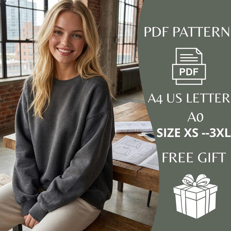 May include: A woman wearing a dark gray sweatshirt, seated at a wooden table. The image includes text that reads "PDF PATTERN", "A4 US LETTER", "SIZE XS --3XL", and "FREE GIFT". A PDF icon and a gift box graphic are also visible.