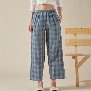 May include: Blue and white checkered wide-leg pants with a high waist and a relaxed fit.