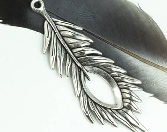 May include: Silver-toned metal feather charm with a detailed design and a hole at the top for attaching to jewellery or crafts.