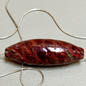 Southwestern Red Hollow Blown Glass Bead Handmade by Michael Ernst on a 20” silver snake chain necklace