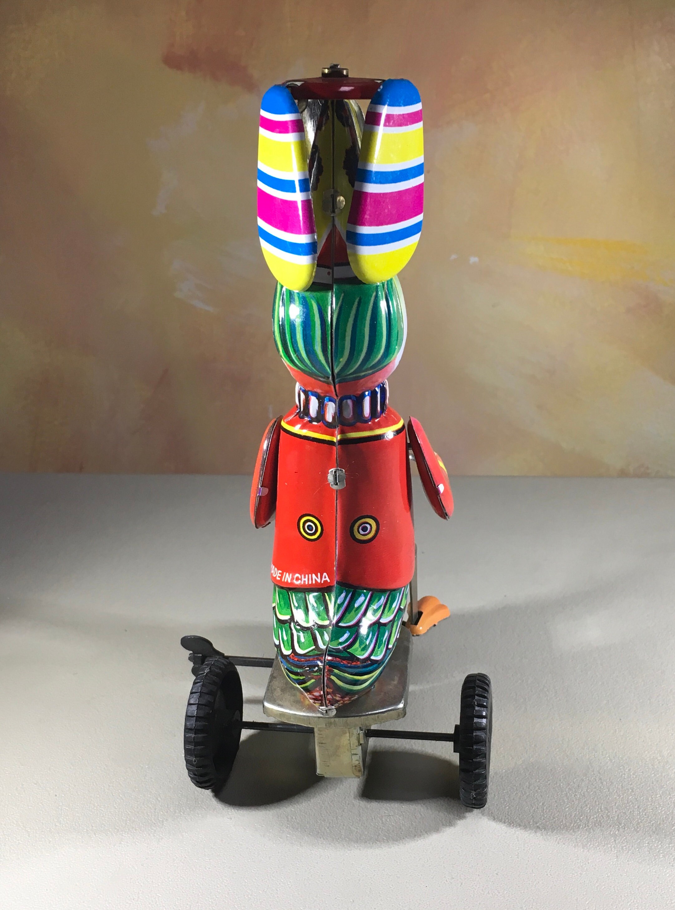 Collectibles Tin wind up toy duck on a bicycle with twirling helicopter