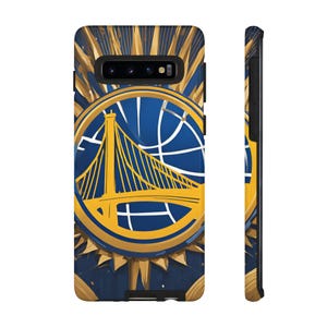 May include: A phone case with a gold and blue design featuring the Golden State Warriors logo. The logo is a stylized image of the Golden Gate Bridge with a basketball net in the background.