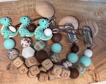 Personalisierte Dinosaurier Schnullerkette Personalisierte Schnulli Schnullerkette, Silikon Holzperlen