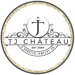 May include: Circular logo with a white background, a black border, and a gold glitter trim. The logo features the text "TJ CHÂTEAU" above "A CURATED JEWELRY CO." and "EST 2009". A stylized "TJ" monogram is at the top.
