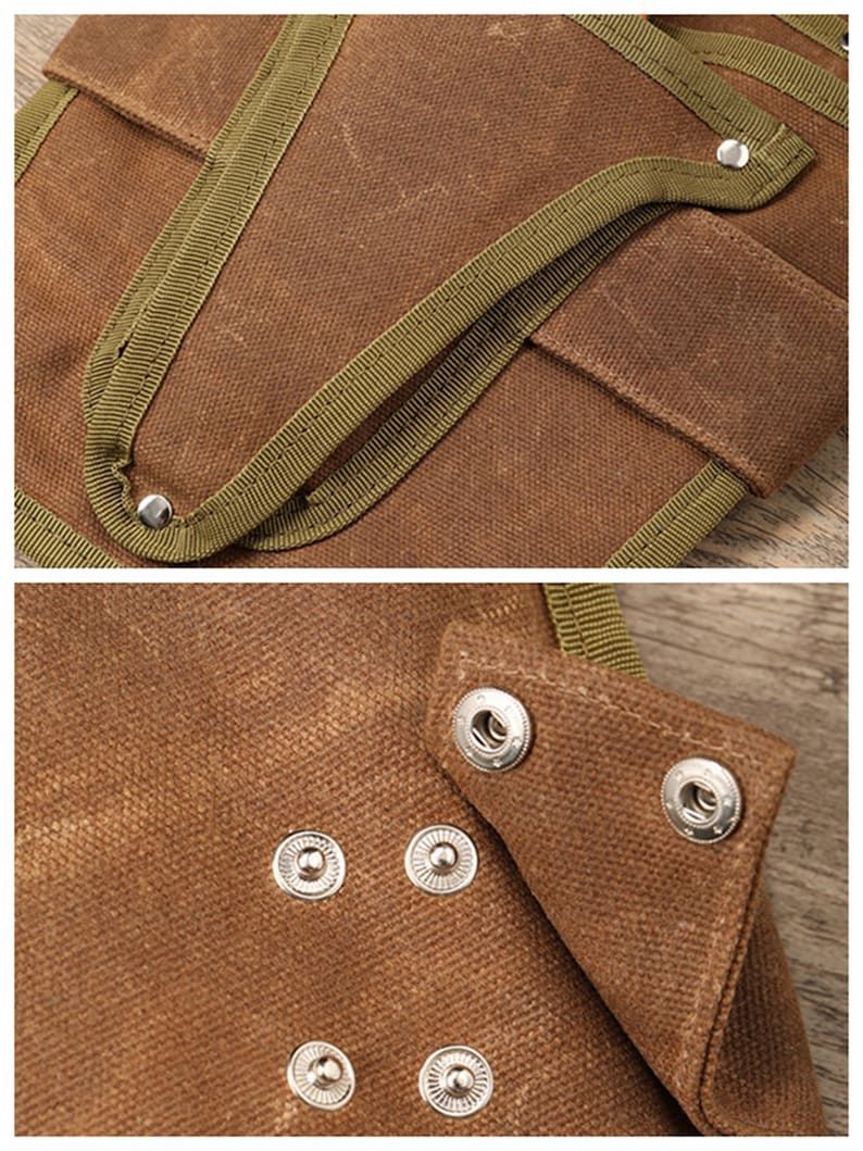 May include: Close-up of a brown canvas tool bag with olive green trim and silver snap closures. The bag has multiple pockets and reinforced stitching, suggesting durability and functionality for carrying tools.