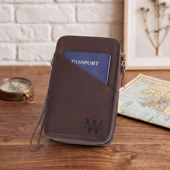 Genuine leather tech organizer that keeps cables, drives, and adapters tidy — and can be personalized, so it's a step above any airport shop version.