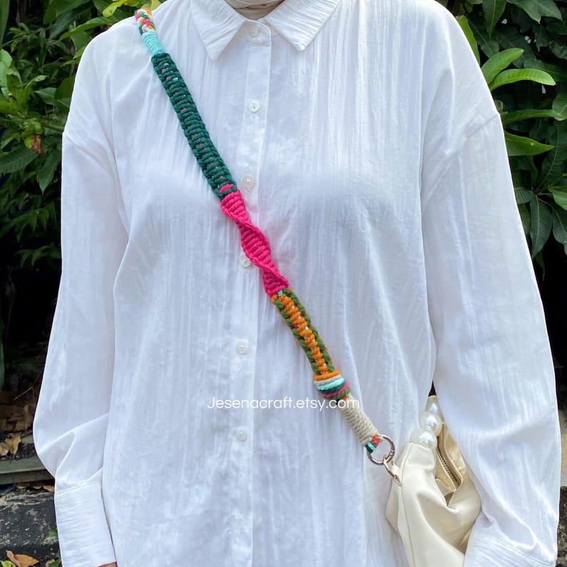 May include: A vibrant macrame bag strap in shades of green, pink, orange, and blue. The strap is connected to a white handbag with a pearl handle. The text "Jesenacraft.etsy.com" is visible.